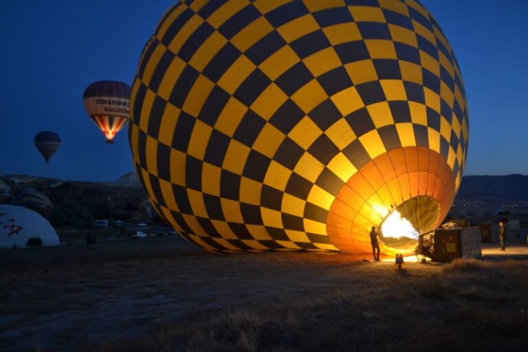 yellow and blue checkered hot air balloon in the dark