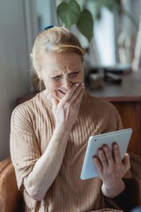 senior woman looking at a digital device