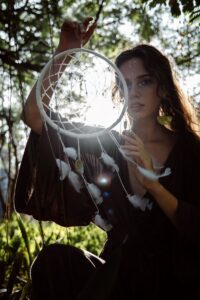 beautiful-woman-holding-a-dream-catcher
