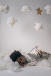 sleeping boy in a decorated studio