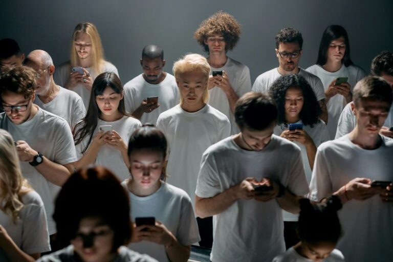 group of young people on their phones