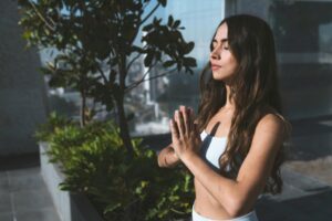 meditating person with her eyes closed