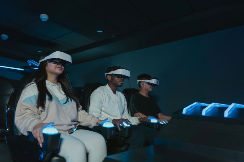 a group of people playing virtual reality glasses